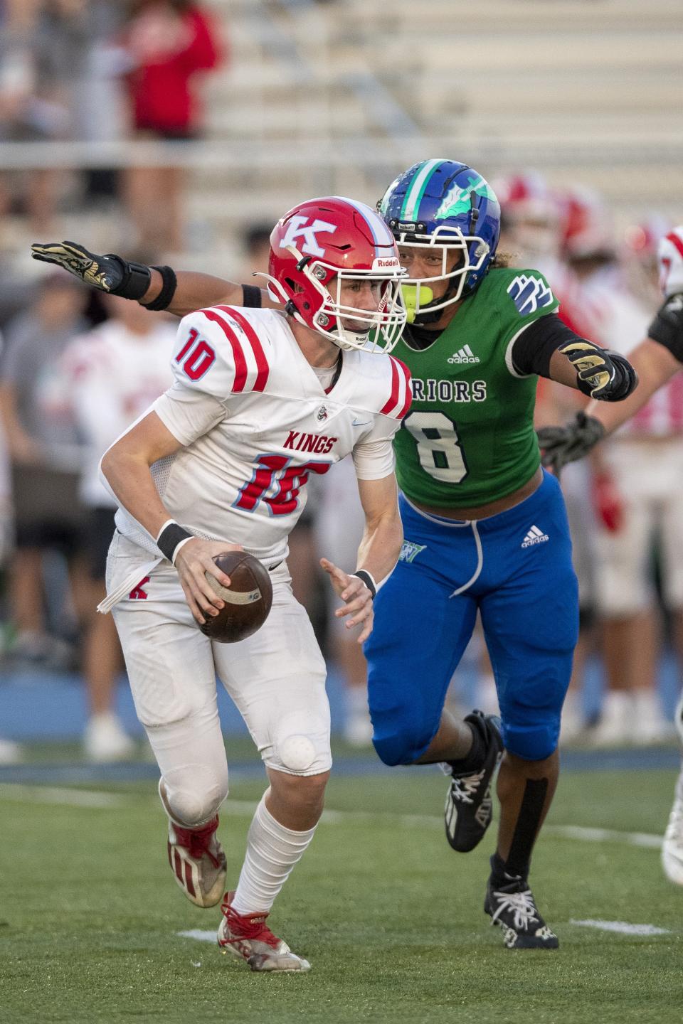 Winton Woods linebacker Justin Hill (8) challenges Kings quarterback Grant Nurre (10) in the first half at Winton Woods High School Sept. 29, 2023.