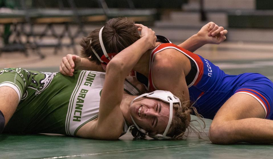 Ocean's Dominic Volek (top) pinned Long Branch's Jason DeNoia in the 132-pound bout Wednesday night in Ocean's 45-24 win.