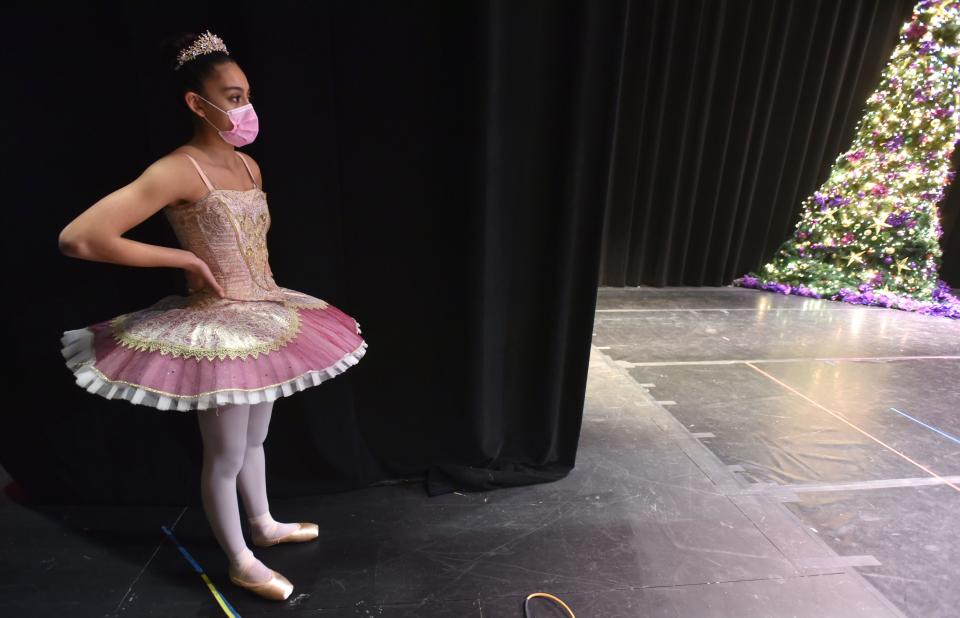Sugar plum Fairy Victoria Arrascue waits for her musical cue backstage at Monomoy High School last month during a dress rehearsal for the Reaching Heart School of Ballet's annual "Nutcracker" performance in Harwich. Victoria plans to spend the next four years dancing in New York City toward her dream of becoming a professional dancer.