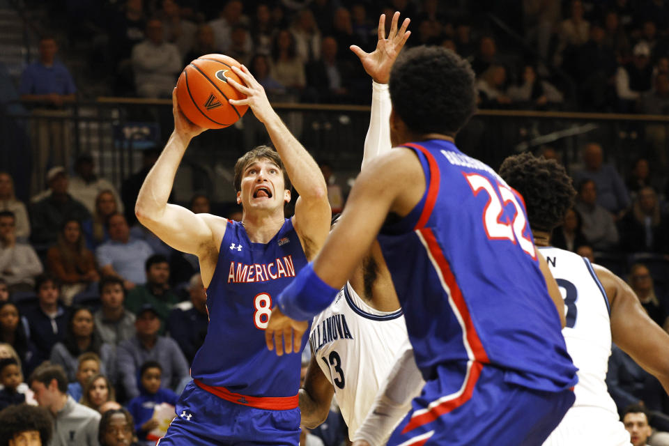 American guard Lorenzo Donadio (8) looks to shoot past Villanova guard Hakim Hart (13) during the first half of an NCAA college basketball game, Monday, Nov. 6, 2023, in Villanova, Pa. (AP Photo/Laurence Kesterson)