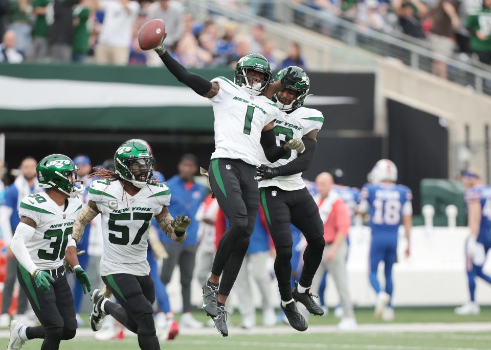 Jets cornerback Sauce Gardner (1) celebrates an interception with teammates during their game against the Bills at MetLife Stadium in East Rutherford, N.J., on Nov. 6, 2022.