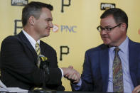 Ben Cherington, left, shakes hands with recently hired team president Travis Williams as he is introduced as the new general manager of the Pittsburgh Pirates baseball team at a news conference, Monday, Nov. 18, 2019, in Pittsburgh. (AP Photo/Keith Srakocic)