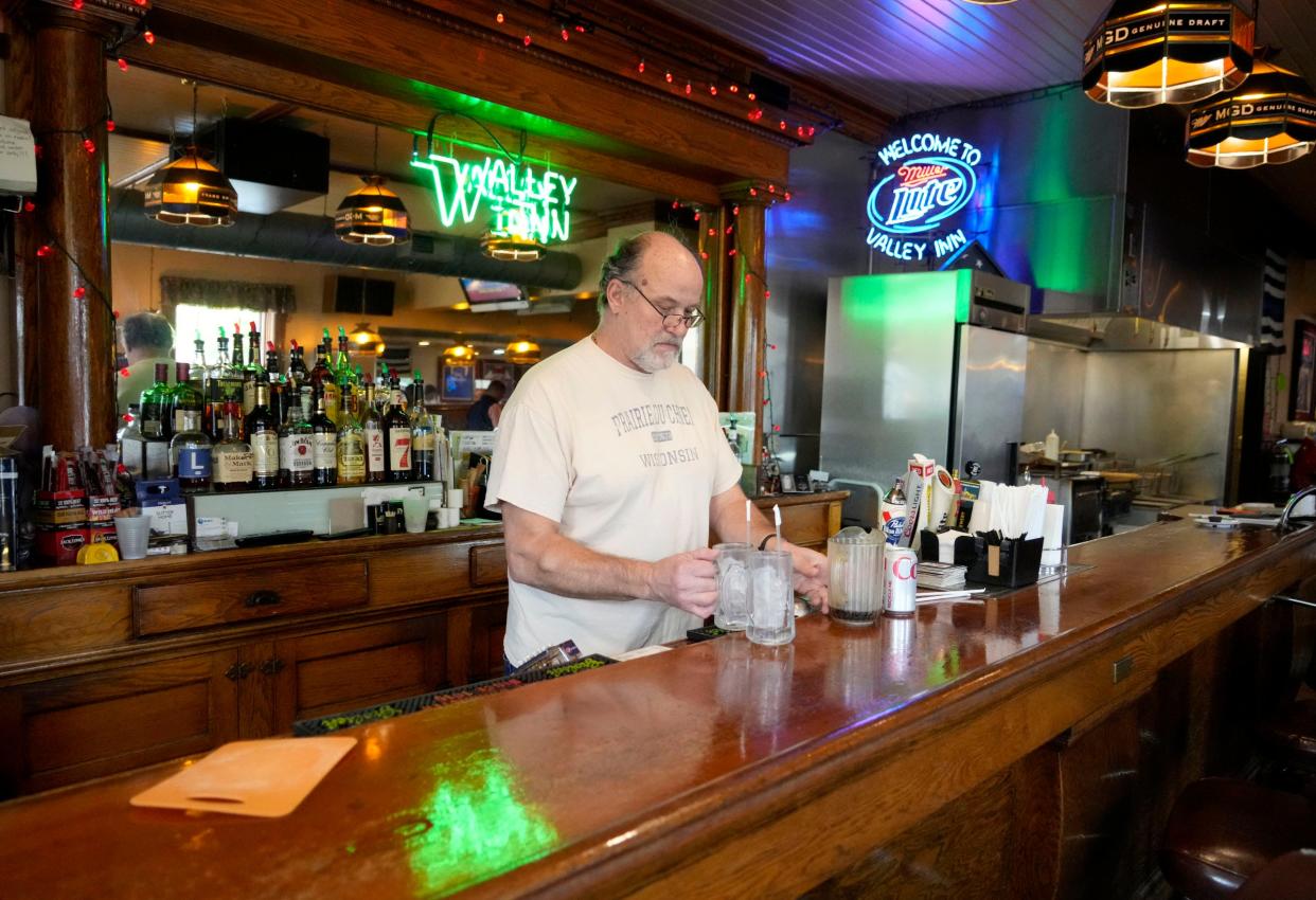 Valley Inn owner Jim Hutterer prepares a drink order at the restaurant at 4000 W. Clybourn St. in the Piggsville neighborhood in Milwaukee on Nov. 7. The Valley Inn is the only business in this tiny neighborhood and a neighborhood social center since the Hutterer family opened it in 1959.