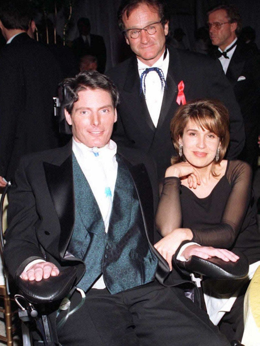 Christopher Reeve (L), wife Dana (R) and Robin Williams (C) pose while at the Governor's Ball after the 68th Annual Academy Awards 25 March in Los Angeles. Reeve made his first appearance before the Hollywood community after an equestrian accident left him paralyzed a year ago.