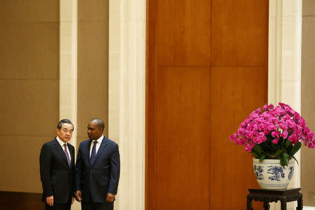 China's Foreign Minister Wang Yi and Burkina Faso Foreign Minister Alpha Barry attend a signing ceremony establishing diplomatic relations between the two countries in Beijing, China, May 26, 2018. REUTERS/Thomas Peter/Pool