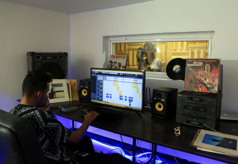 Moroccan rapper Houda Abouz, 24, known by her stage name "Khtek", records a song inside a studio in Rabat