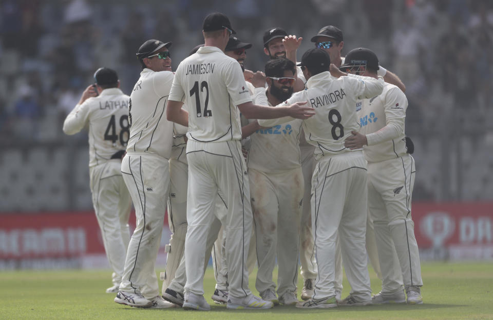 New Zealand's Ajaz Patel celebrates the dismissal of India's Mohammed Siraj during the day two of their second test cricket match with India in Mumbai, India, Saturday, Dec. 4, 2021.(AP Photo/Rafiq Maqbool)