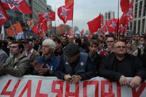 Opposition activists and supporters take part in an anti-Putin protest in central in Moscow. A sea of protestors, brandishing the red flags of socialism, nationalist tricolours or liberal slogans, filled the avenue in Moscow named after the great Soviet physicist and celebrated dissident Andrei Sakharov