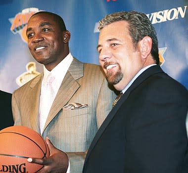 Knicks owner James Dolan (right) still speaks to Isiah Thomas regularly and tried to rehire him as a consultant until the NBA blocked the move