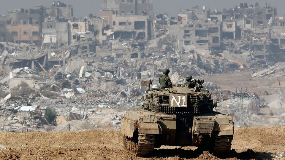 An Israeli tank looks over the war-torn Gaza Strip from a position in southern Israel, January 19, 2024. - Jack Guez/AFP/Getty Images