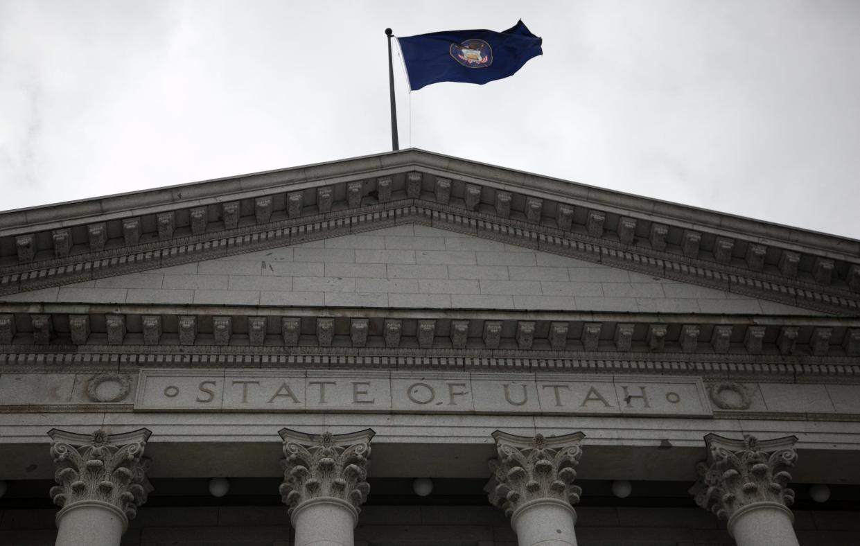 The Utah State Flag flies above the Utah State Capitol Building. The Utah Legislature is considering a new official state flag and the proposed redesign received approval this week in the state Senate.