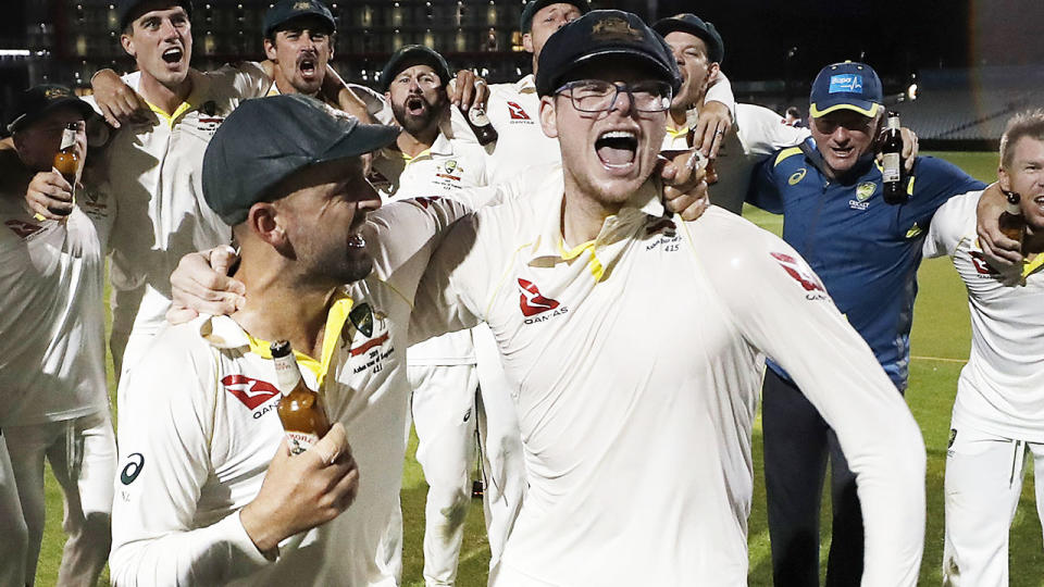 Steve Smith, pictured here wearing glasses during celebrations after the fourth Ashes Test.