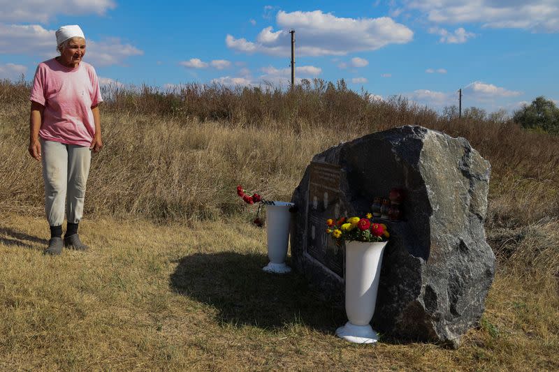 Vira Chernukha at her damaged house in the village of Dementiivka in Kharkiv region