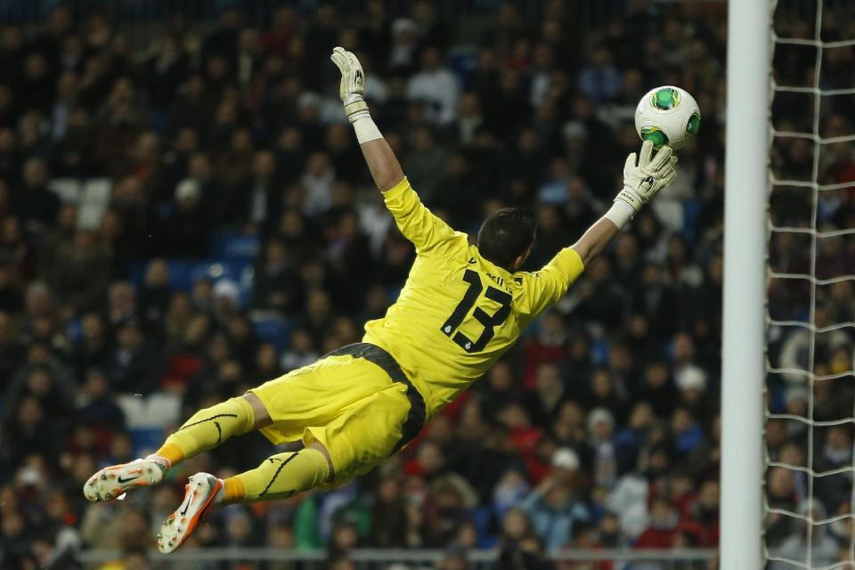 Espanyol's goalkeeper Francisco "Kiko" Casilla makes a save during a Copa del Rey soccer match between Real Madrid and Espanyol at the Santiago Bernabeu stadium in Madrid, Spain, Tuesday, Jan. 28, 2014. (AP Photo/Andres Kudacki)