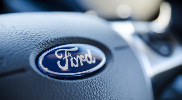 Ford (F Stock) logo on a steering wheel.