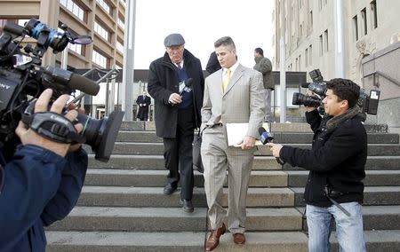 An attorney for Chicago police officer Jason Van Dyke leaves the George N. Leighton Criminal Court building after a bond hearing in Chicago, Illinois November 24, 2015. REUTERS/Frank Polich