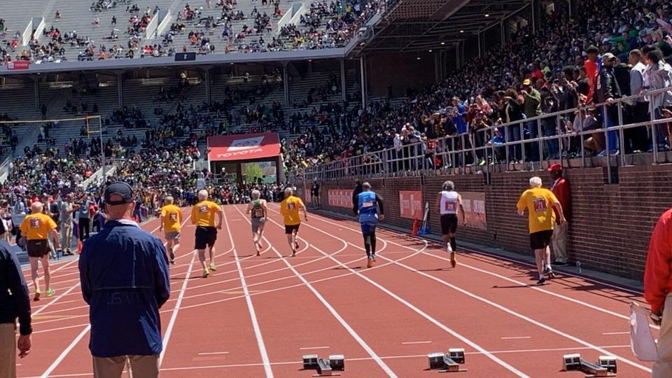 Long Branch 100-year-old Lester Wright (second from right, white shirt) races in the master's 100-meter dash at the Penn Relays