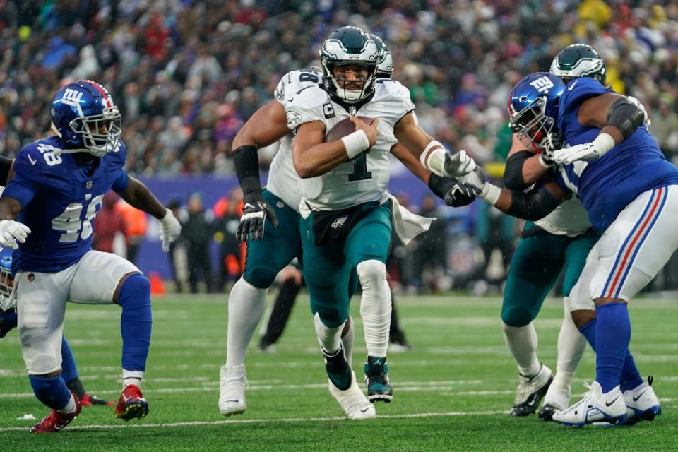 Philadelphia Eagles quarterback Jalen Hurts threw for 217 yards and ran in for a touchdown himself (Bryan Woolston/AP) (AP)