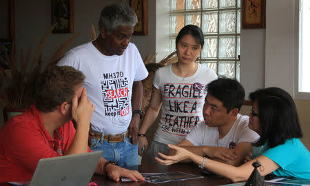 Relatives of some passengers aboard a Malaysia Airlines Flight MH370, carrying 239 passengers and crew, that went missing more than two years ago meet before addressing journalists at the Gassy Country House Hotel in Antananarivo, Madagascar, December 4, 2016; ahead of a search of the country's beaches for debris from the missing plane. REUTERS/Clarel Faniry Rasoanaivo