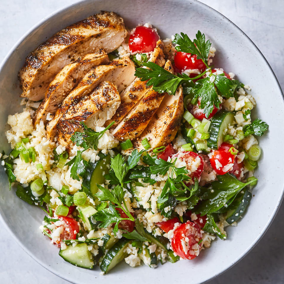 <p>Chicken breasts on the grill have a smoky flavor that's enhanced with an easy spice rub. We chose flat-leaf parsley in this salad because it has a stronger herbal taste than its sometimes-bitter curly counterpart. <a href="https://www.eatingwell.com/recipe/279027/spiced-grilled-chicken-with-cauliflower-rice-tabbouleh/" rel="nofollow noopener" target="_blank" data-ylk="slk:View Recipe" class="link ">View Recipe</a></p>