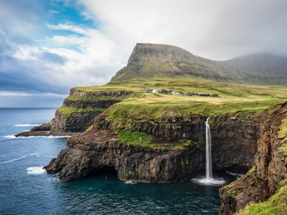 Visit the Mulafossur waterfall on the Faroe Islands this summer (Getty Images)