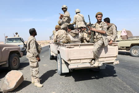 Soldiers loyal to Yemen's President Abd-Rabbu Mansour Hadi ride on the back of a truck in the Majaz district of Yemen's northwestern province of Marib after the pro-Hadi forces took it from Houthi rebels December 18, 2015. REUTERS/Ali Owidha