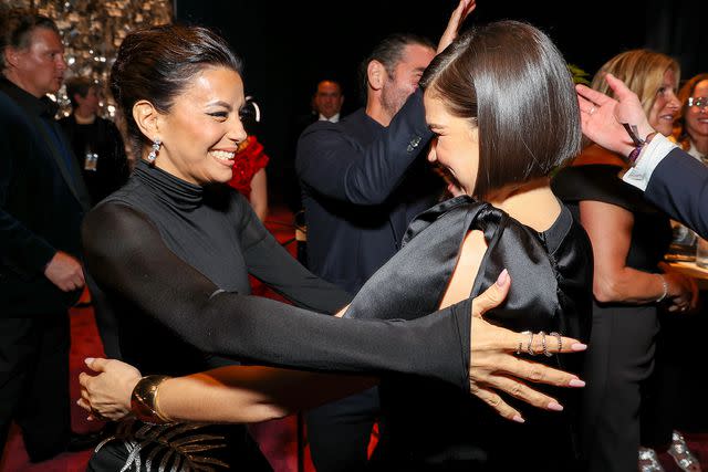 <p>Kevin Mazur/Getty</p> Eva Longoria and America Ferrera