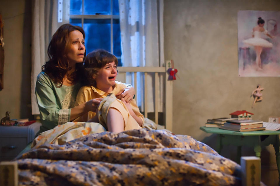 Lili Taylor and Joey King in The Conjuring