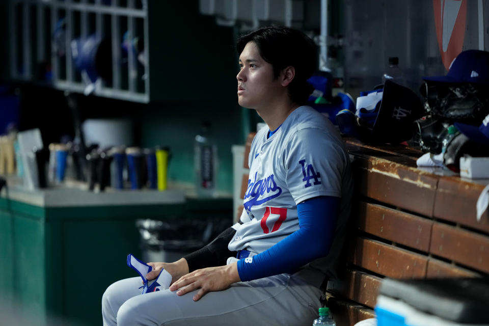 CINCINNATI, OHIO - MAY 25: Shohei Ohtani #17 of the Los Angeles Dodgers sits in the dugout in the fourth inning against the Cincinnati Reds at Great American Ball Park on May 25, 2024 in Cincinnati, Ohio. (Photo by Dylan Buell/Getty Images)