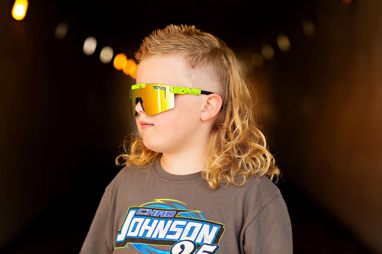 Emmitt Bailey, 8 of Menomonie, poses for his submission photos for the 2022 USA Mullet Championships.