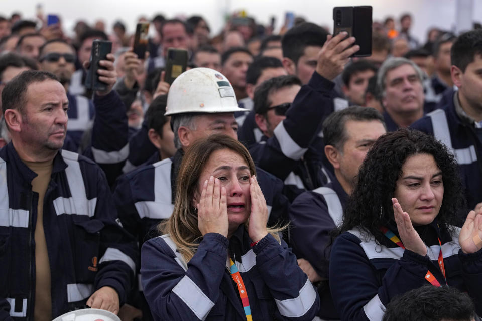 Workers at the Ventanas Smelter, which belongs to the state-owned company Codelco, attend a closure ceremony on the first day of its closure in Quintero Bay in Puchuncavi, Chile, Wednesday, May 31, 2023. Chilean President Gabriel Boric announced in June 2022 the gradual closure of the world's leading copper producer in order to reduce the constant episodes of environmental pollution that affect the coastal communes near the furnace. (AP Photo/Esteban Felix)