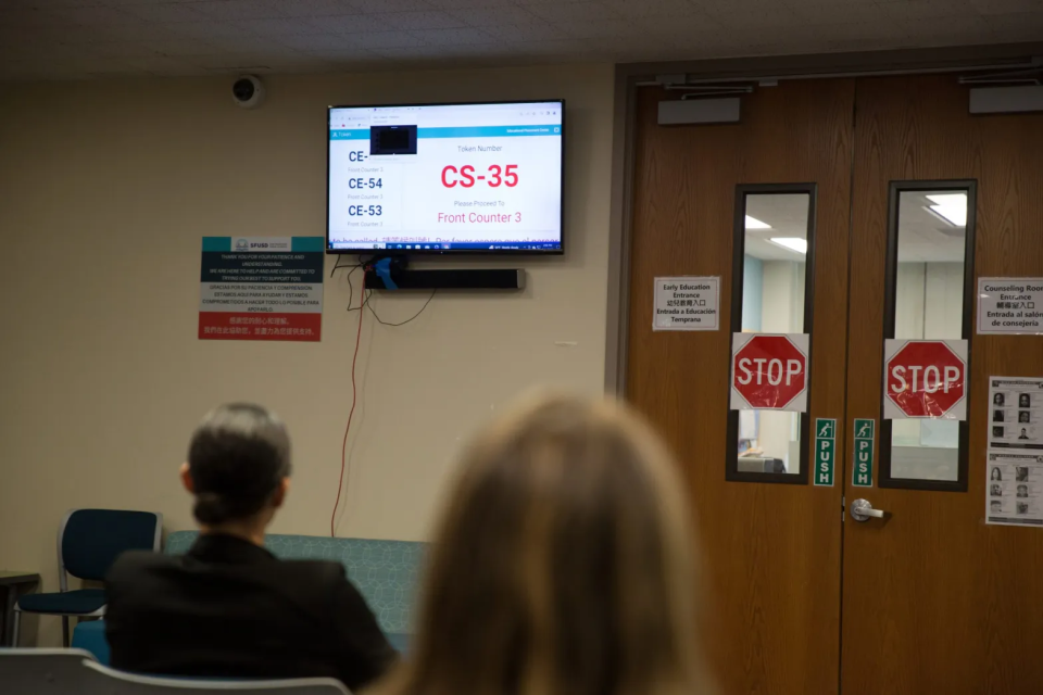 Parents and caregivers, some of whom don’t yet have a school assignment for their child, wait to speak with counselors at SFUSD’s Enrollment Center two days before the 2023-24 school year begins. (Sonya Abrams/The Hechinger Report)