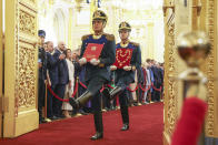 Honour guards of the Presidential regiment carry a special copy of the Russian Constitution and the President's Badge prior to an inauguration ceremony of Vladimir Putin as Russian president in the Grand Kremlin Palace in Moscow, Russia, Tuesday, May 7, 2024. (Alexander Kazakov, Sputnik, Kremlin Pool Photo via AP)