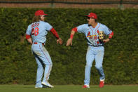 St. Louis Cardinals outfielders Lars Nootbaar, right, and Harrison Bader (48) celebrate after defeating the Chicago Cubs 8-5 in a baseball game Saturday, Sept. 25, 2021, in Chicago. (AP Photo/Paul Beaty)