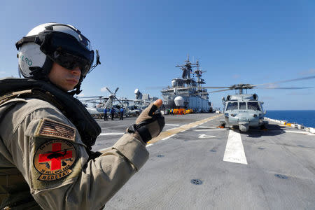 An Army medevac soldier preps a Navy MH-60S Sea Hawk helicopter aboard the USS Kearsarge as the evacuation of U.S. military personnel from the U.S. Virgin Islands continues in advance of Hurricane Maria, in the Caribbean Sea near the islands September 18, 2017. REUTERS/Jonathan Drake