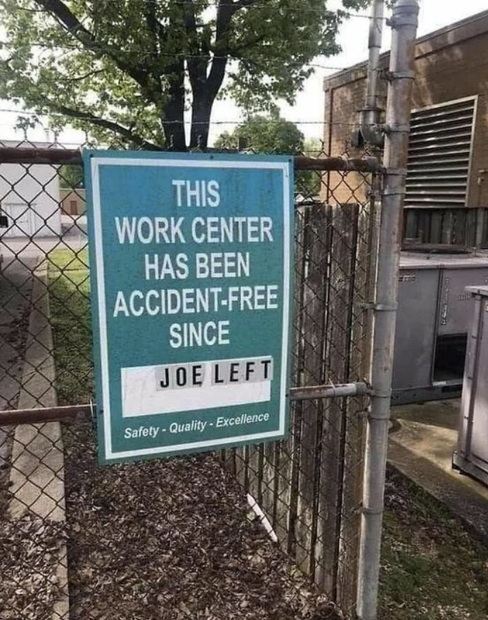 Sign states "This work center has been accident-free since Joe left" with safety and quality excellence slogans below