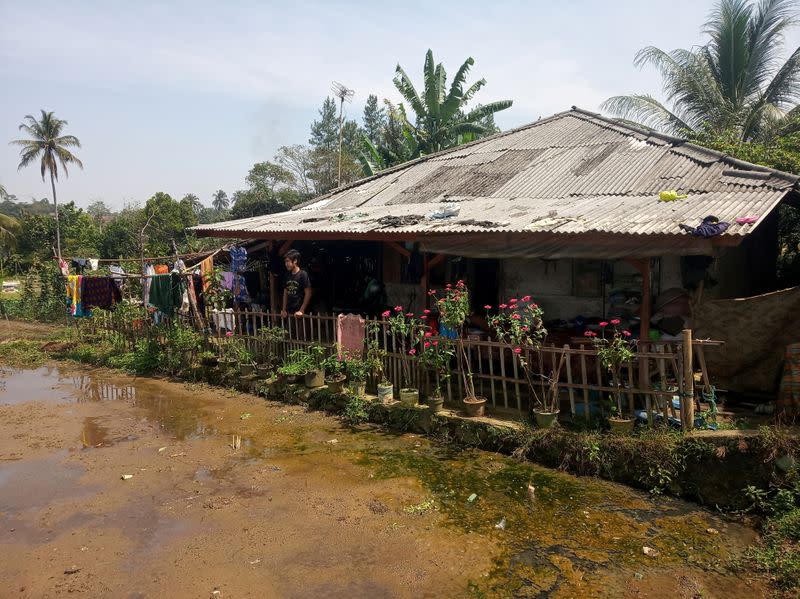 Ari Harifin stands at his family's house amid the coronavirus disease (COVID-19) outbreak in Sukabumi