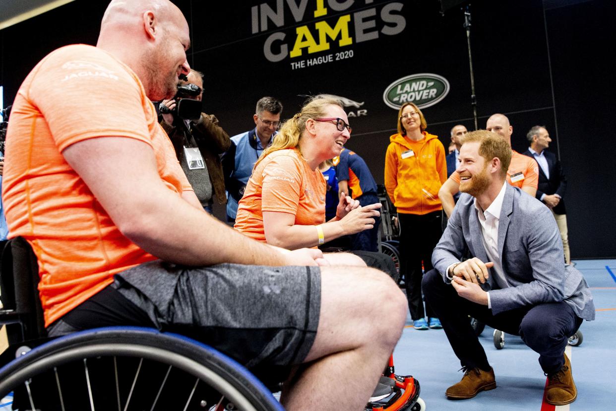 Prince Harry (R) greets athletes during the presentation of the Invictus Games The Hague 2020, in The Hague, Netherlands, on May 9, 2019. - The fifth Invictus Games The Hague 2020, an international sporting event for wounded, injured and sick servicepersonnel, will be held in the Zuiderpark in 2020. (Photo by patrick van katwijk / ANP / AFP) / Netherlands OUT        (Photo credit should read PATRICK VAN KATWIJK/AFP via Getty Images)