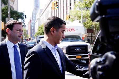 Sanjay Valvani (C) departs Federal Court after a hearing following his arrest in New York, U.S., June 15, 2016. REUTERS/Lucas Jackson