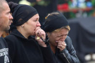 People mourn during a memorial ceremony before the funeral of victims of an attack on a local college in the city of Kerch, Crimea October 19, 2018. REUTERS/Pavel Rebrov