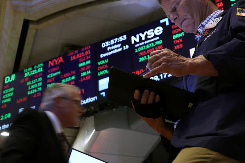 Traders work on the floor of the NYSE in New York