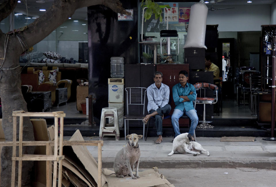 In this Dec. 17, 2018, photo, salesmen wait for customers at a shop at the Nampally furniture market in Hyderabad, India. This furniture market, where customers haggle over prices and work with carpenters to design made-to-order housewares, is the kind of competition Swedish giant Ikea faces in tackling the $40 billion Indian market for home furnishings, which is growing quickly along with the country’s consumer class. Six months after Ikea opened its first store in Hyderabad on Aug. 9, the 400,000-square-foot cornucopia of furniture, linens, kitchenware, and other goodies is drawing between 10,000 and 30,000 visitors per day. (AP Photo/Mahesh Kumar A.)