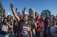 <p>Veronica Curry, front with hoop ear rings raises her fist with other Black Lives Matter supporters during a rally for Stephon Clark, a man that was shot by Sacramento Police Sunday night on southbound Interstate 5 near Old Sacramento, Calif., on Thursday, March 22, 2018. (Photo: Hector Amezcua/TNS via ZUMA Wire) </p>