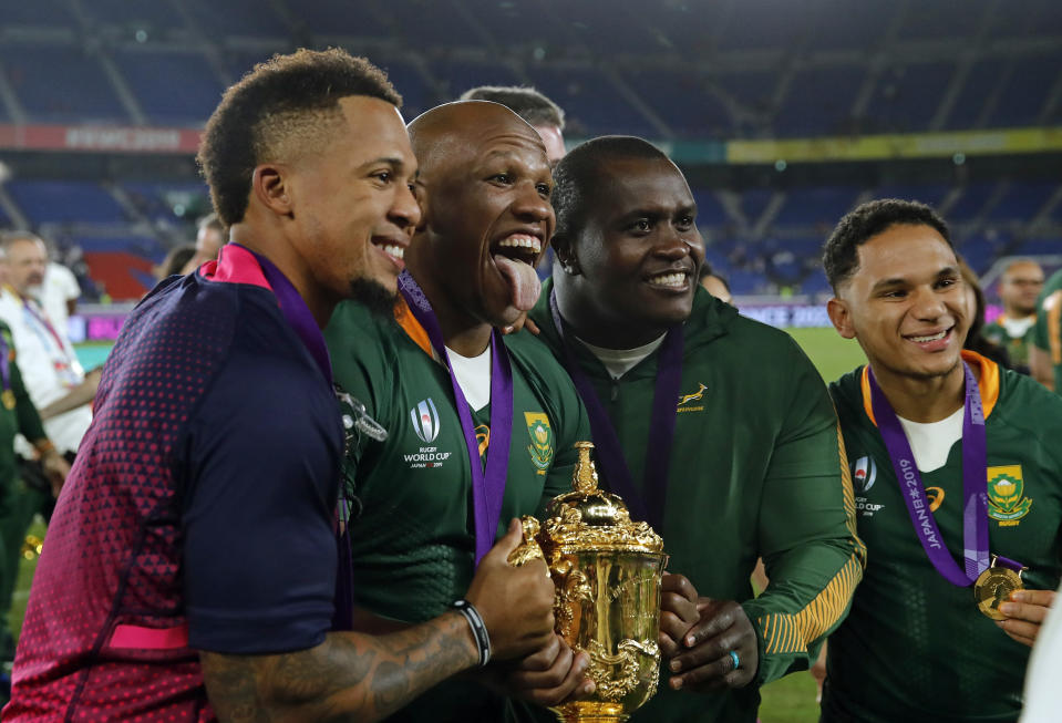 South African players celebrate at the end of the Rugby World Cup final at International Yokohama Stadium between England and South Africa in Yokohama, Japan, Saturday, Nov. 2, 2019. South Africa won 32-12. (AP Photo/Christophe Ena)