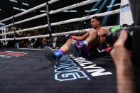 Rolando Romero starts to get up after being knocked down during the sixth round of his WBA lightweight championship boxing bout against Gervonta Davis early Sunday, May 29, 2022, in New York. Davis won in the sixth round. (AP Photo/Frank Franklin II)