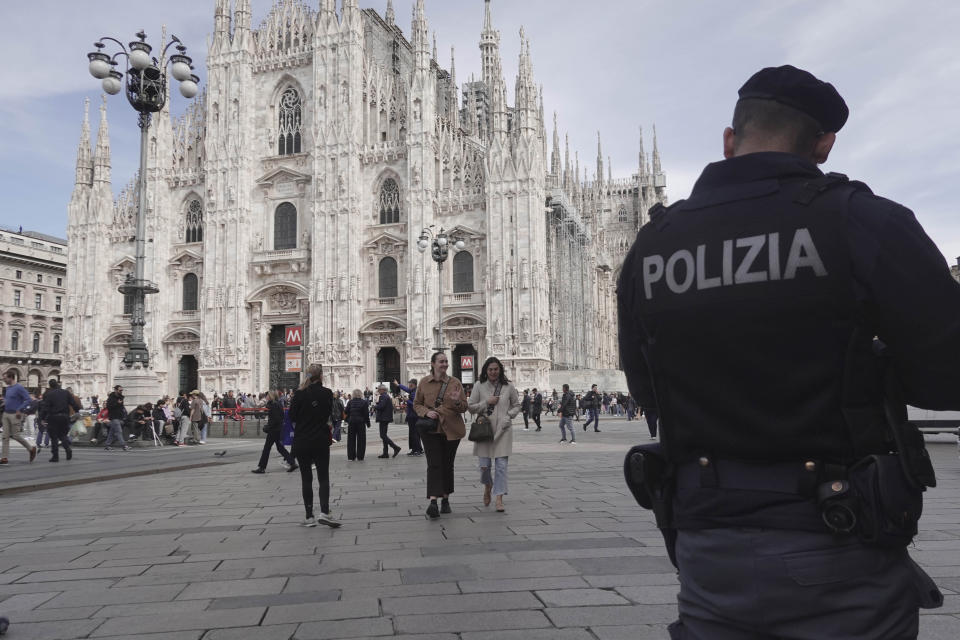 Police patrol in front of Milan gothic cathedral in Milan, Monday, March 25, 2024. Italy followed France Monday in stepping up its security stance following the attack on a suburban Moscow concert hall and the claim of responsibility by an affiliate of the Islamic State group. (AP Photo/Luca Bruno)