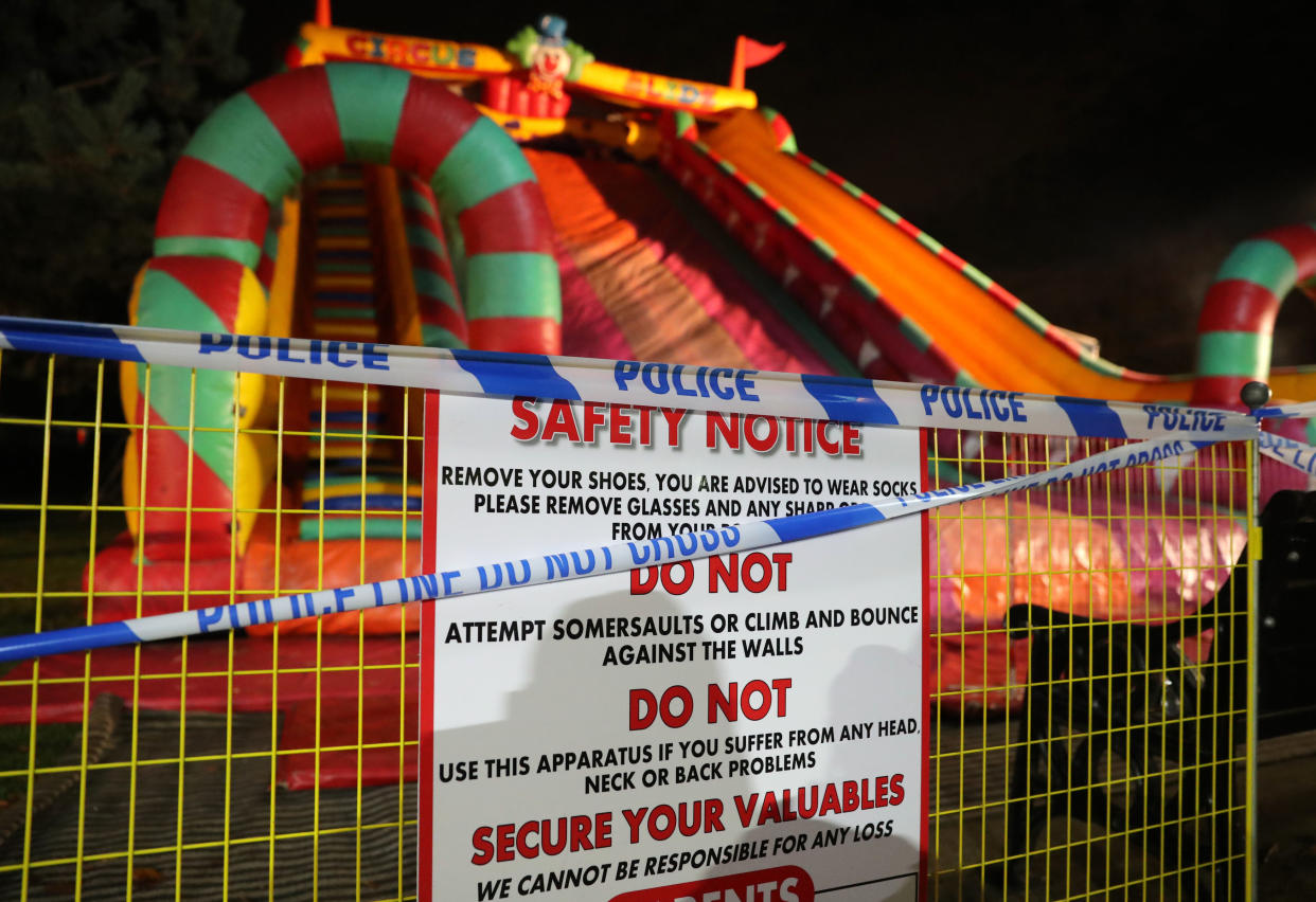 <em>Eight children were injured after an inflatable slide collapsed at a funfair at a fireworks display in Woking (Picture: PA)</em>