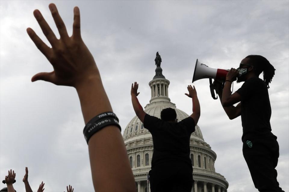 In this June 3, 2020, file photo demonstrators protest the death of George Floyd as they gather on the East side of the U.S. Capitol in Washington. (AP Photo/Jacquelyn Martin, File)