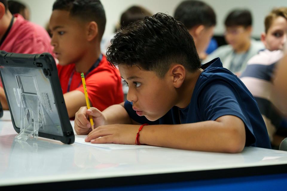 Adrian Lopez works in the Verizon Innovative Learning Lab at Alhambra Traditional School on Aug. 28, 2023, in Phoenix.
