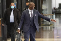 Actor Jussie Smollett's defense attorney Nenye Uche reacts to reporters Wednesday, Dec. 1, 2021, in the lobby of the Leighton Criminal Courthouse during a lunch break on day three of his client's trial in Chicago. Smollett is accused of lying to police when he reported he was the victim of a racist, anti-gay attack in downtown Chicago nearly three years ago. (AP Photo/Charles Rex Arbogast)